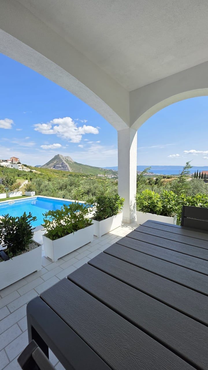 MareVista terrace with sea view and outdoor dining in Kučine near Split